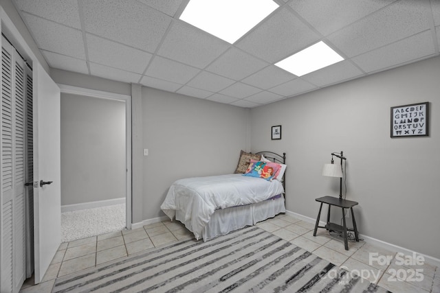 110 Spring Path, Hendersonville, NC 28739 - bedroom with tile patterned floors, a drop ceiling, and baseboards