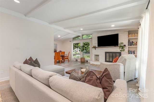 747 Saint Michaels Ln Unit 7, Gastonia, NC 28052 - living area featuring wood finished floors, a brick fireplace, and recessed lighting