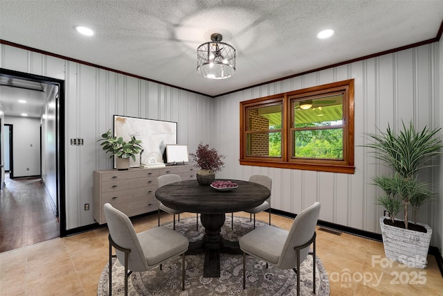 191 Rolling Green Dr, Sylva, NC 28779 - dining space with crown molding, a decorative wall, recessed lighting, and a chandelier