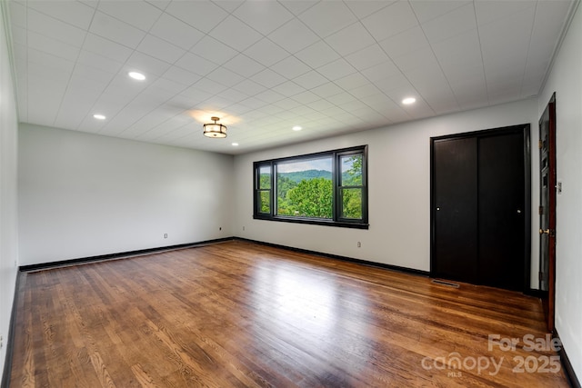 191 Rolling Green Dr, Sylva, NC 28779 - unfurnished bedroom with wood finished floors, recessed lighting, and baseboards