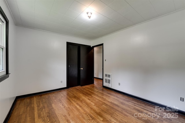 191 Rolling Green Dr, Sylva, NC 28779 - spare room with wood finished floors, baseboards, and crown molding
