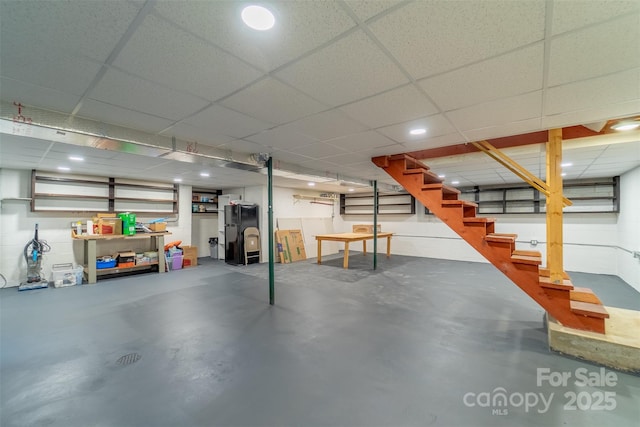 191 Rolling Green Dr, Sylva, NC 28779 - finished below grade area featuring stairs, freestanding refrigerator, and a paneled ceiling
