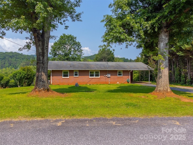 191 Rolling Green Dr, Sylva, NC 28779 - ranch-style house featuring a front yard, brick siding, and an attached carport