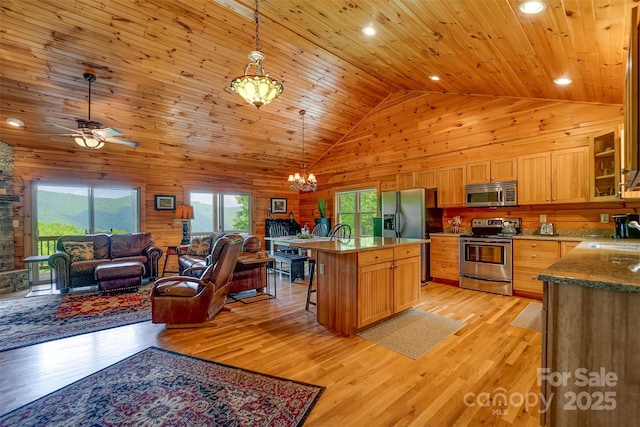 938 Trickle Creek Rd, Waynesville, NC 28785 - kitchen featuring stainless steel appliances, open floor plan, plenty of natural light, wood ceiling, and a chandelier