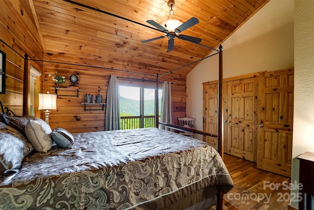 938 Trickle Creek Rd, Waynesville, NC 28785 - bedroom featuring wood finished floors, wood ceiling, wood walls, ceiling fan, and high vaulted ceiling
