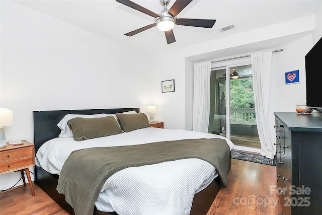 433 W 8th St Unit 66, Charlotte, NC 28202 - bedroom with access to exterior, wood finished floors, and a ceiling fan
