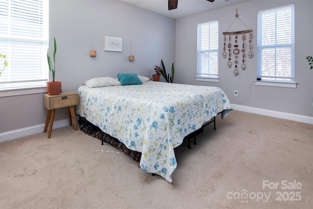 15907 Rose Glenn Ln, Davidson, NC 28036 - carpeted bedroom featuring multiple windows, baseboards, and ceiling fan