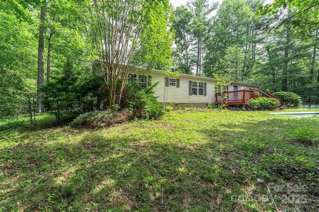38 Hidden Forest Dr, Hendersonville, NC 28792 - view of green lawn featuring a wooden deck