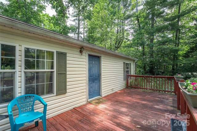 38 Hidden Forest Dr, Hendersonville, NC 28792 - wooden deck with view of scattered trees