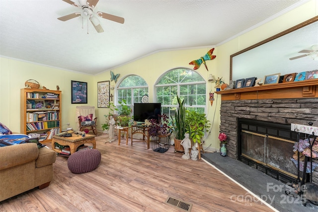 38 Hidden Forest Dr, Hendersonville, NC 28792 - living room with a ceiling fan, crown molding, wood finished floors, lofted ceiling, and a fireplace