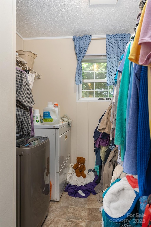 38 Hidden Forest Dr, Hendersonville, NC 28792 - washroom featuring washer and clothes dryer, a textured ceiling, and crown molding