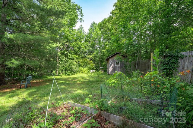38 Hidden Forest Dr, Hendersonville, NC 28792 - view of yard featuring a garden and a shed