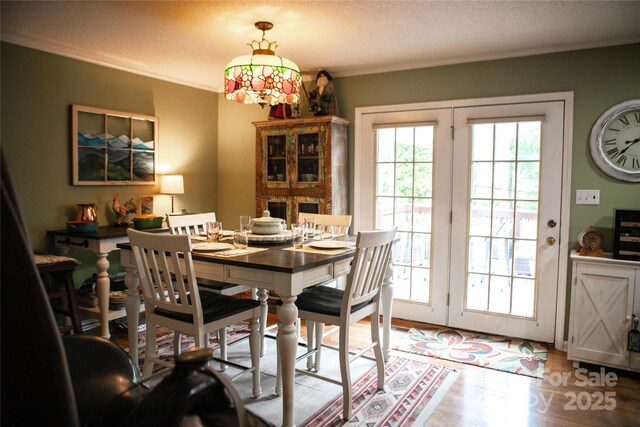 171 Shores Way, Boone, NC 28607 - dining area featuring wood finished floors, crown molding, and a textured ceiling