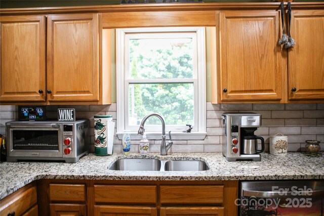 171 Shores Way, Boone, NC 28607 - kitchen featuring a sink, stainless steel dishwasher, decorative backsplash, and light stone counters