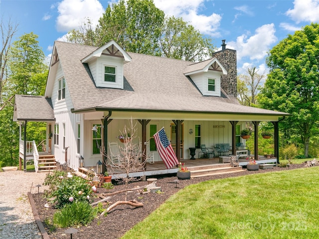 540 Windswept Ridge Rd, Canton, NC 28716 - view of front facade with covered porch, a chimney, a shingled roof, board and batten siding, and a front yard