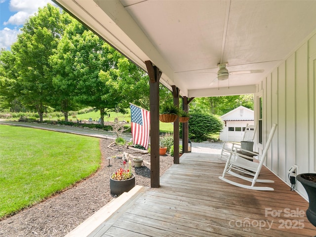 540 Windswept Ridge Rd, Canton, NC 28716 - deck featuring a ceiling fan, a yard, and an outbuilding