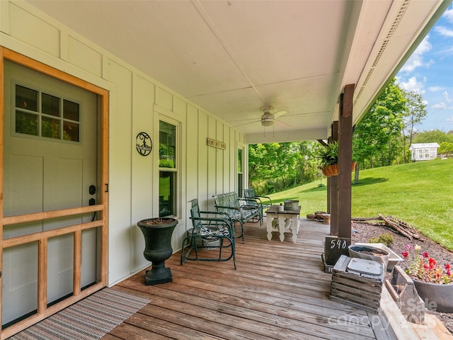 540 Windswept Ridge Rd, Canton, NC 28716 - wooden porch with a ceiling fan and a lawn
