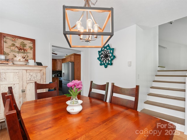 540 Windswept Ridge Rd, Canton, NC 28716 - dining area featuring a chandelier and stairs