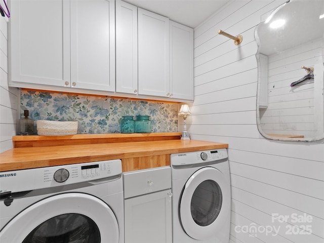 540 Windswept Ridge Rd, Canton, NC 28716 - laundry area featuring washer and clothes dryer, cabinet space, and wooden walls