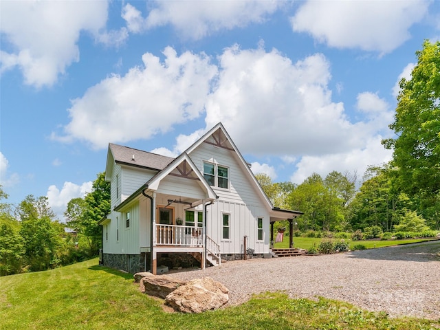 540 Windswept Ridge Rd, Canton, NC 28716 - modern farmhouse with covered porch, board and batten siding, and a front yard