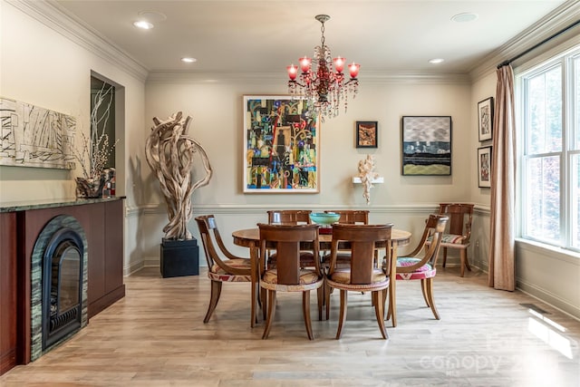 7 White Palmer Ct, Biltmore Lake, NC 28715 - dining space featuring a chandelier, light wood finished floors, recessed lighting, a glass covered fireplace, and crown molding