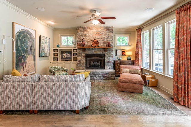 7 White Palmer Ct, Biltmore Lake, NC 28715 - living area featuring healthy amount of natural light, a ceiling fan, crown molding, wood finished floors, and a stone fireplace