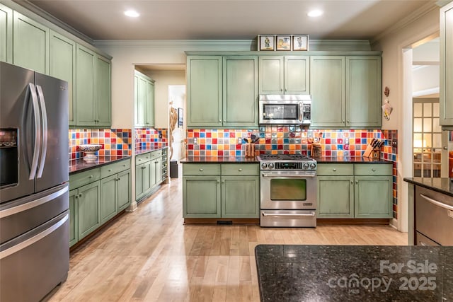 7 White Palmer Ct, Biltmore Lake, NC 28715 - kitchen featuring green cabinetry, appliances with stainless steel finishes, ornamental molding, light wood finished floors, and recessed lighting