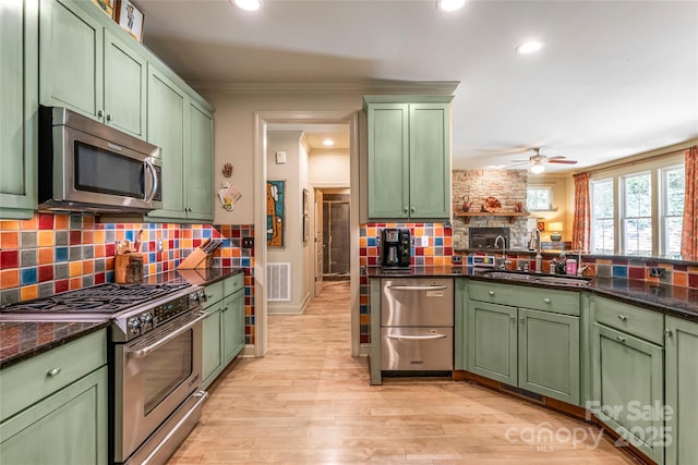 7 White Palmer Ct, Biltmore Lake, NC 28715 - kitchen featuring stainless steel appliances, green cabinets, tasteful backsplash, a ceiling fan, and crown molding