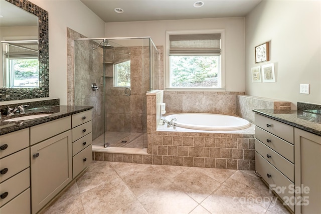 7 White Palmer Ct, Biltmore Lake, NC 28715 - full bathroom with vanity, a stall shower, a garden tub, and plenty of natural light