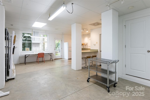 7 White Palmer Ct, Biltmore Lake, NC 28715 - below grade area featuring rail lighting and freestanding refrigerator