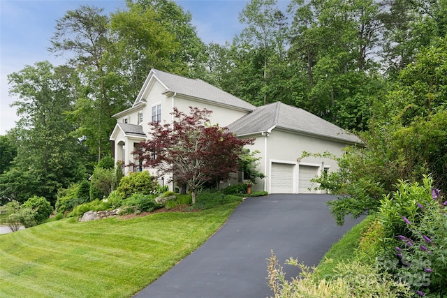 7 White Palmer Ct, Biltmore Lake, NC 28715 - view of front of house with stucco siding, asphalt driveway, a garage, a front lawn, and a shingled roof