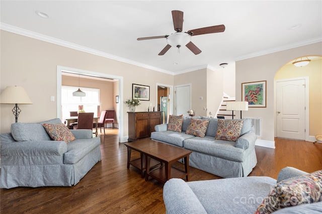 1701 Truman Rd, Charlotte, NC 28205 - living area featuring stairs, crown molding, dark wood finished floors, ceiling fan, and arched walkways