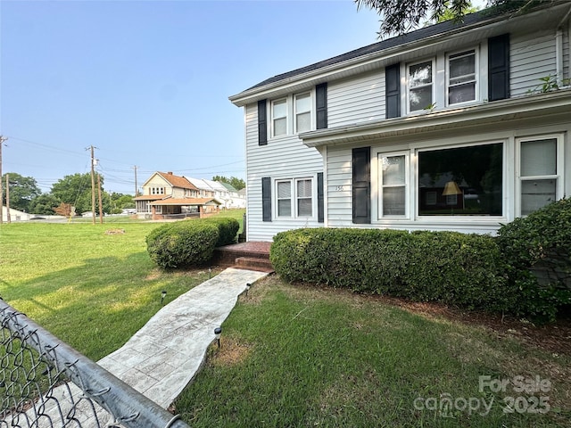 156 Spruce St, Badin, NC 28009 - view of front facade with a front yard