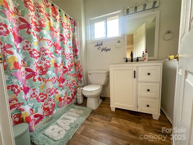 156 Spruce St, Badin, NC 28009 - full bath with toilet, vanity, wood finished floors, and a shower with curtain
