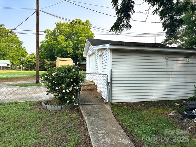 156 Spruce St, Badin, NC 28009 - view of property exterior featuring a gate and an outdoor structure