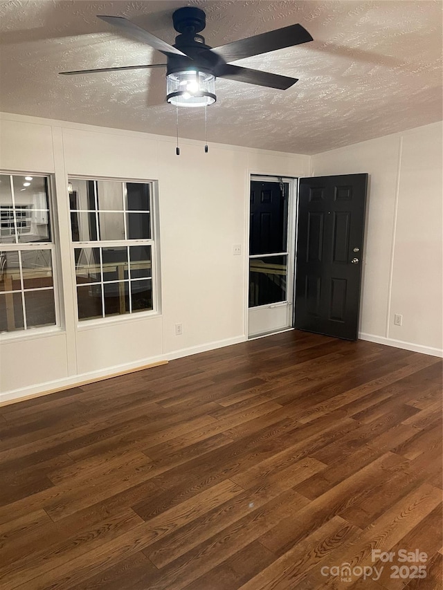 6219 Heavner Rd, Vale, NC 28168 - unfurnished room with ceiling fan, a textured ceiling, wood finished floors, and baseboards