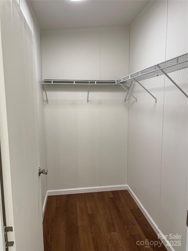 6219 Heavner Rd, Vale, NC 28168 - spacious closet featuring dark wood-style flooring