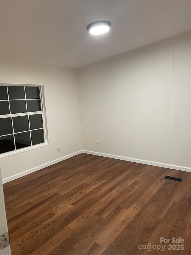 6219 Heavner Rd, Vale, NC 28168 - unfurnished room with dark wood-style flooring and baseboards