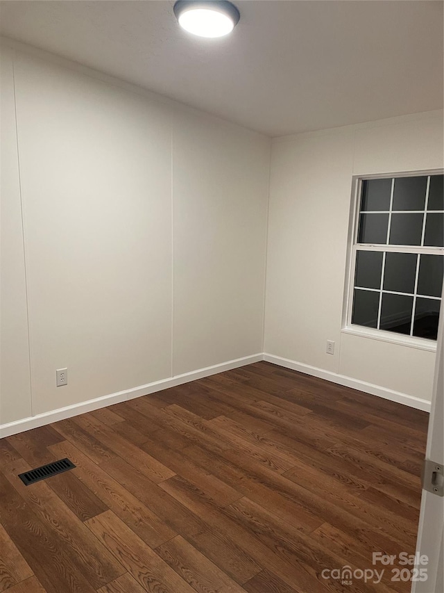 6219 Heavner Rd, Vale, NC 28168 - empty room featuring dark wood-style floors and baseboards