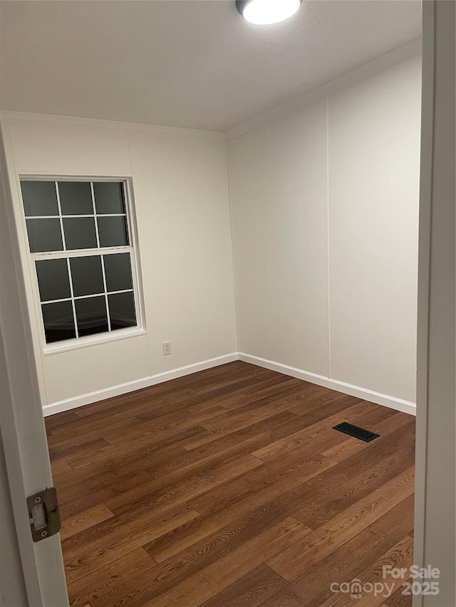 6219 Heavner Rd, Vale, NC 28168 - empty room with dark wood finished floors and baseboards
