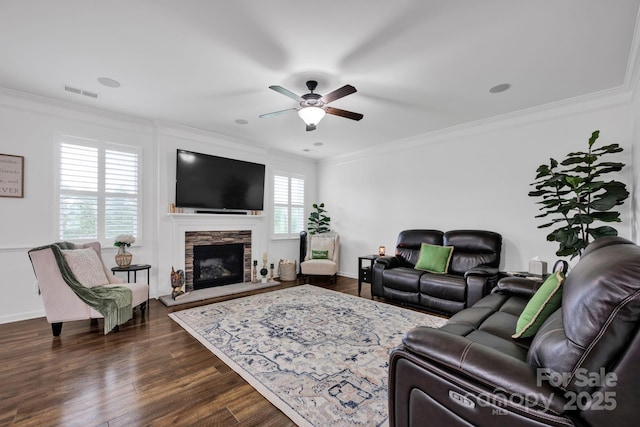 246 Bushney Loop, Mooresville, NC 28115 - living room with ceiling fan, ornamental molding, a stone fireplace, dark wood-type flooring, and baseboards