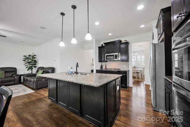 246 Bushney Loop, Mooresville, NC 28115 - kitchen featuring stainless steel appliances, open floor plan, crown molding, light stone countertops, and dark wood-style flooring
