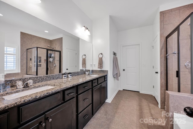246 Bushney Loop, Mooresville, NC 28115 - full bathroom featuring double vanity, a stall shower, tile patterned floors, and baseboards
