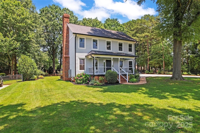 18733 Bluff Point Rd, Cornelius, NC 28031 - view of front facade with covered porch and a chimney