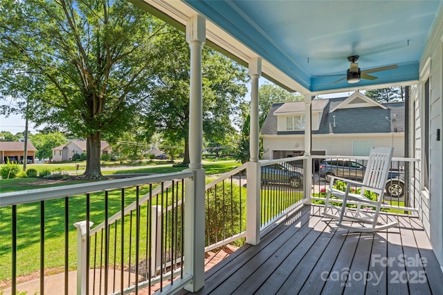 18733 Bluff Point Rd, Cornelius, NC 28031 - wooden porch featuring a ceiling fan, a lawn, and a residential view