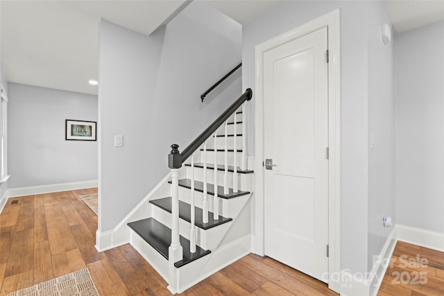 18733 Bluff Point Rd, Cornelius, NC 28031 - stairs with wood-type flooring and recessed lighting