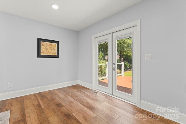18733 Bluff Point Rd, Cornelius, NC 28031 - spare room featuring hardwood / wood-style floors and recessed lighting