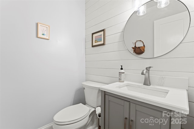 18733 Bluff Point Rd, Cornelius, NC 28031 - bathroom featuring vanity and wooden walls