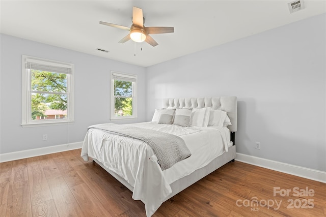 18733 Bluff Point Rd, Cornelius, NC 28031 - bedroom featuring wood finished floors and ceiling fan