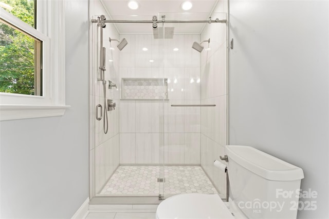 18733 Bluff Point Rd, Cornelius, NC 28031 - bathroom featuring a stall shower, tile patterned floors, and recessed lighting